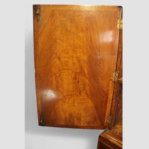 Queen Anne style walnut cabinet door inside