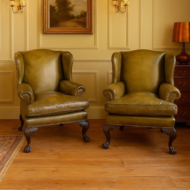 Antique green leather Irish wingchairs