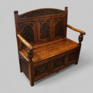 Edwardian golden oak settle at angle