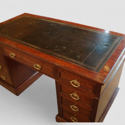 Edwardian mahogany pedestal desk top at angle