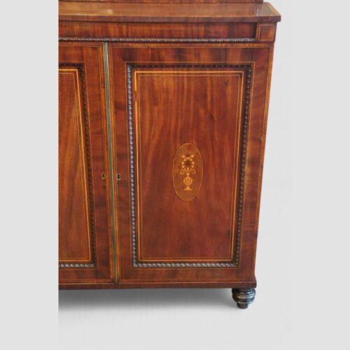 Regency mahogany inlaid chiffonier door