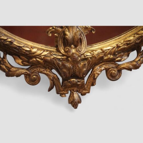 19thc. oval gilt framed mirror lower carving detail