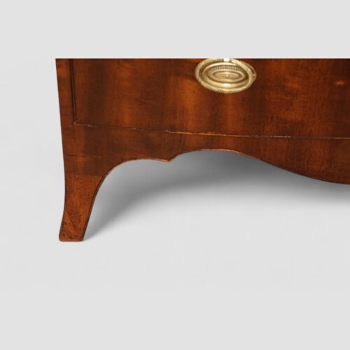 George VI mahogany bow front chest splay feet