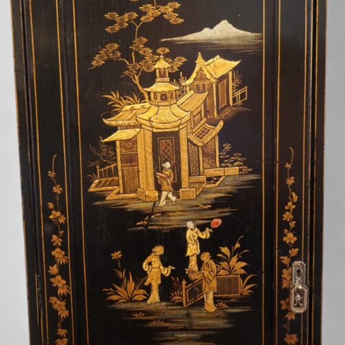 Pair of black lacquer Chinoiserie cupboards left panel
