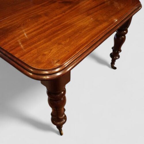 William IV mahogany extending dining table corner