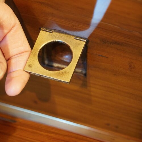 Brass bound yew wood serving cabinet handle lifted