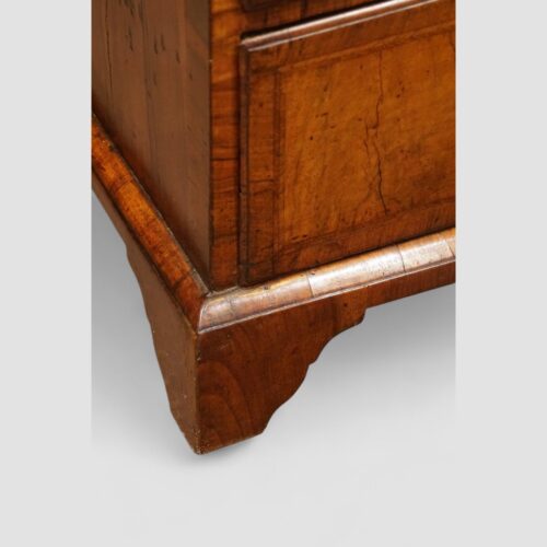 George III walnut bureau bracket foot