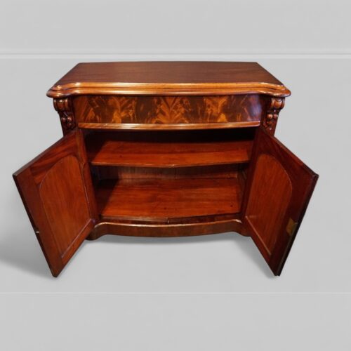 Victorian mahogany serpentine chiffonier interior of cupboard