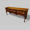 Georgian oak cabriole leg dresser base angle view