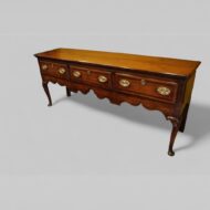Georgian oak cabriole leg dresser base angle view