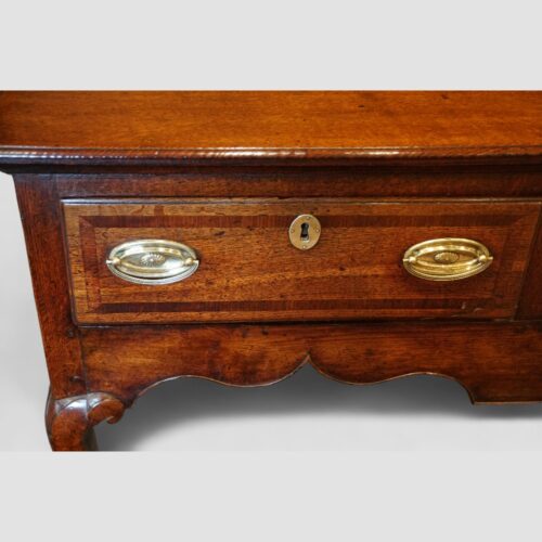 Georgian oak cabriole leg dresser base drawer detail