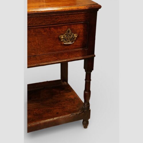 Early 19thc oak pot board dresser base corner leg