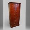 Edwardian fiddleback mahogany Wellington chest at angle