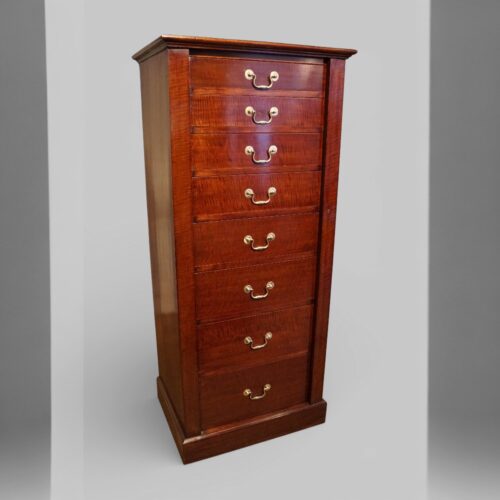 Edwardian fiddleback mahogany Wellington chest at angle