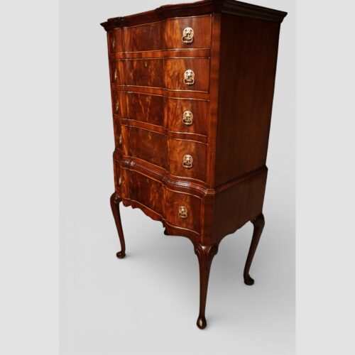 George I style serpentine mahogany chest on stand angle view