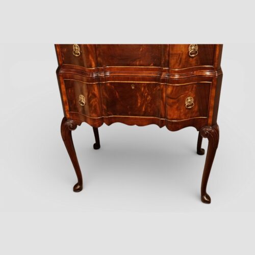 George I style serpentine mahogany chest on stand base detail