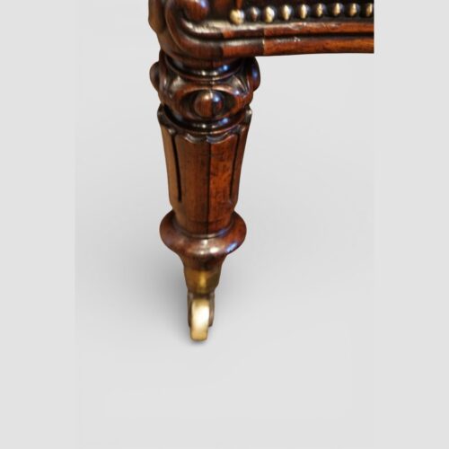 Pair of Victoran button back open arm chairs front leg