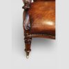 Pair of Victoran button back open arm chairs front leg and arm