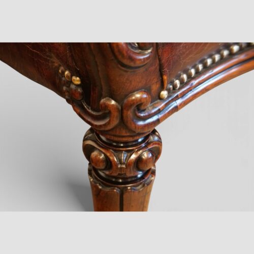 Pair of Victoran button back open arm chairs leg detail