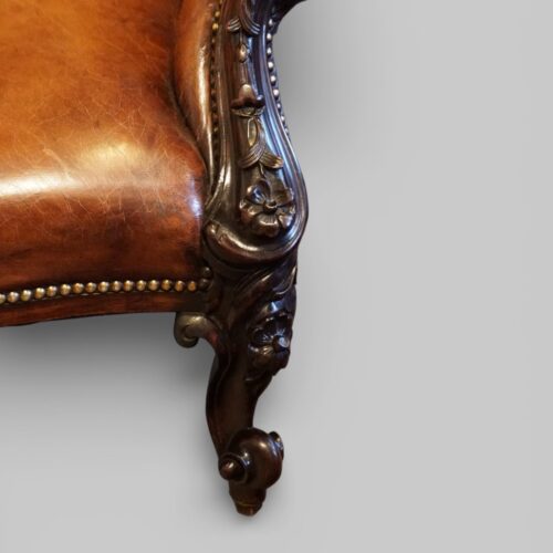 Pair of Victorian button leather reading chairs carving