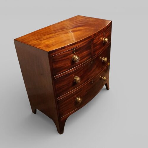 Regency mahogany bow front chest small size at angle