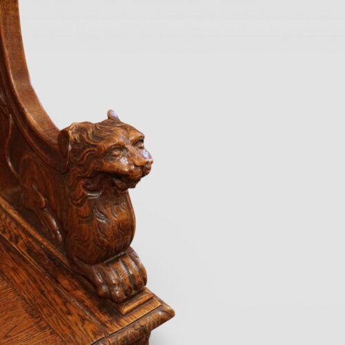 Victorian carved oak settle arm