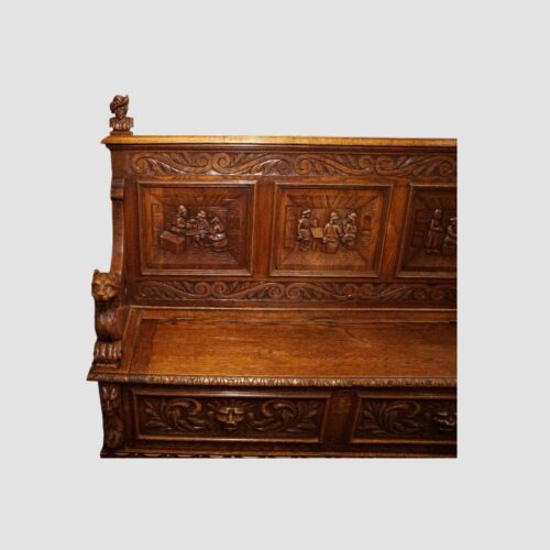 Victorian carved oak settle end detail