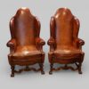 Pair of Edwardian leather wing back chairs