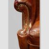 Pair of Edwardian leather wing back chairs arm detail