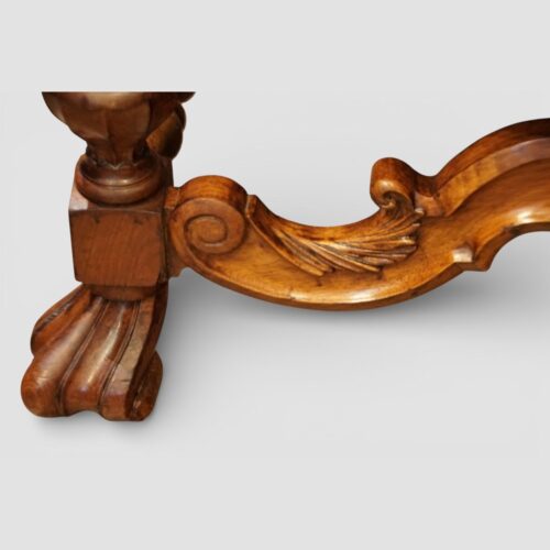 Pair of Edwardian leather wing back chairs carved leaf