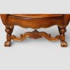 Pair of Edwardian leather wing back chairs legs and front stretcher