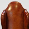 Pair of Edwardian leather wing back chairs shaped back