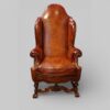 Pair of Edwardian leather wing back chairs single