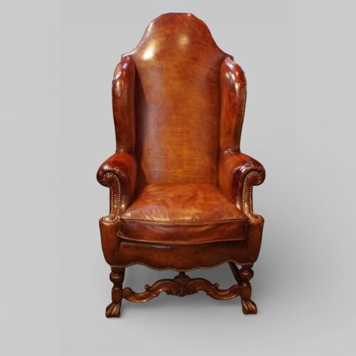 Pair of Edwardian leather wing back chairs single