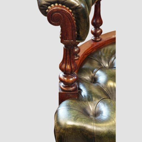 Pair of Victorian green leather tub chairs arm support