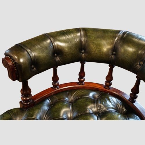 Pair of Victorian green leather tub chairs back detail