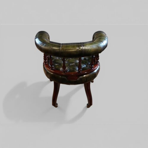 Pair of Victorian green leather tub chairs rear