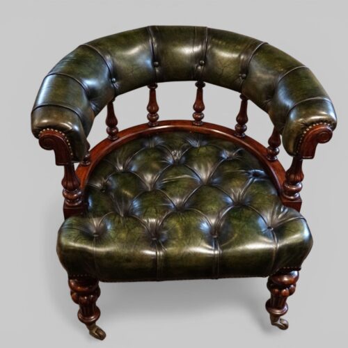 Pair of Victorian green leather tub chairs seat