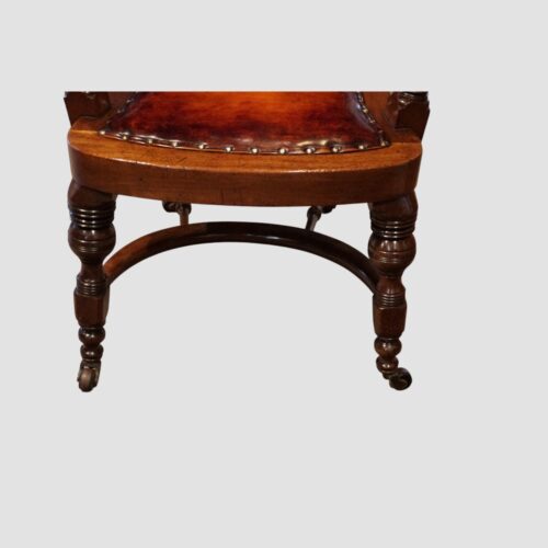 Victorian buttoned leather desk chair front leg