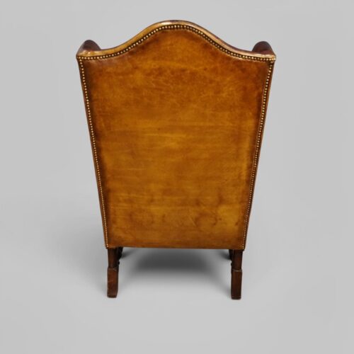 Pair of William and Mary leather wing chairs rear