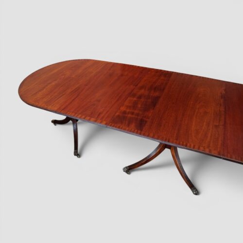 Regency style mahogany 3 pillar dining table angle