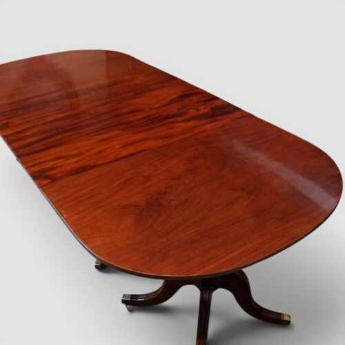 Antique mahogany 3 pillar dining table closed with no leaves end view