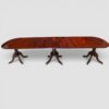 Antique mahogany triple pillar dining table