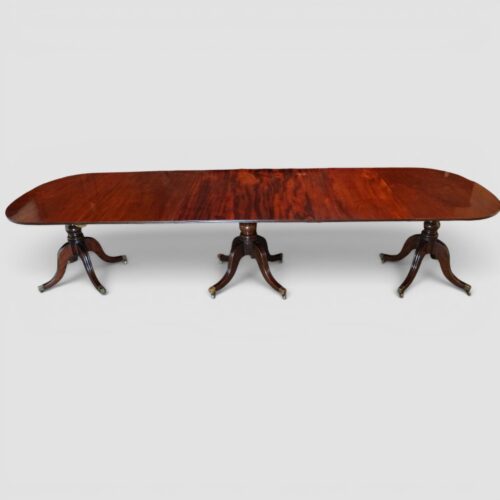 Antique mahogany triple pillar dining table