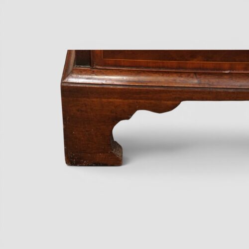 George III mahogany crossbanded chest shaped bracket foot