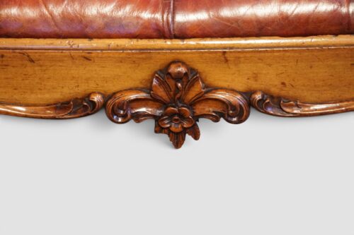 Antique Victorian walnut footstool upholstered in fine hand-dyed antiqued English leather.