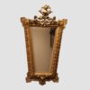 Full view of ornate antique gilt trapezoidal mirror, 130cm high and 76cm wide
