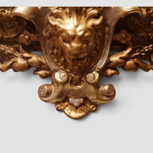 Antique silver-gilt and gilt mirror with intricate scrolling foliate decoration
