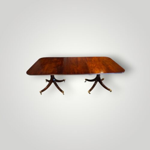 Regency style mahogany twin pillar dining table side view