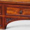 High-quality Victorian English mahogany writing table with green leather top and carved turned legs by Holland & Sons.